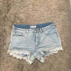Denim shorts with lace trimmings